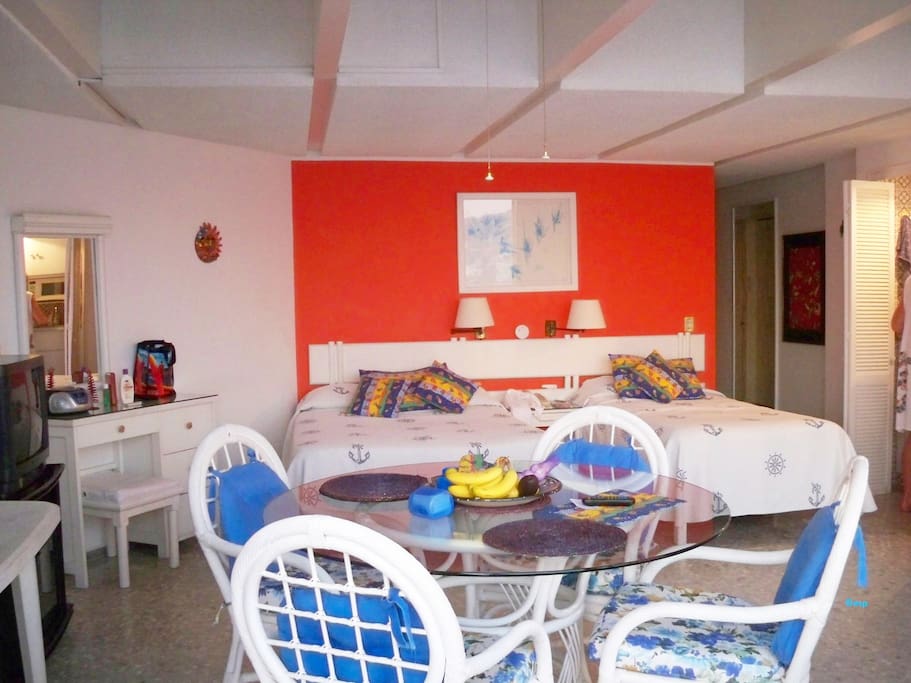 Inside dining area, bed area, make-up vanity and mirror