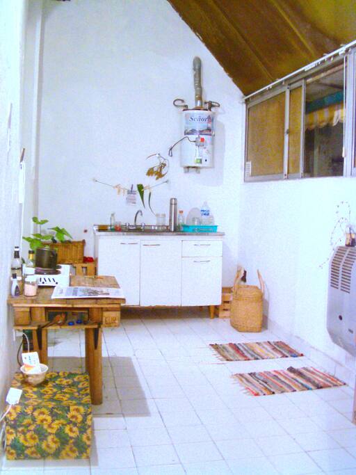 kitchen and living room , there will be a table and chairs