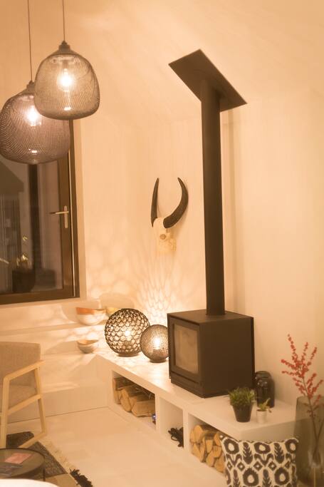 The cosy fireplace in the living room area