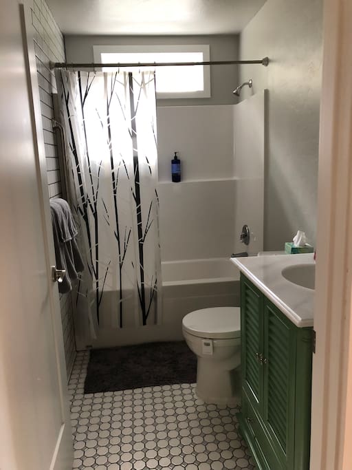 Full bath with tub and shower.