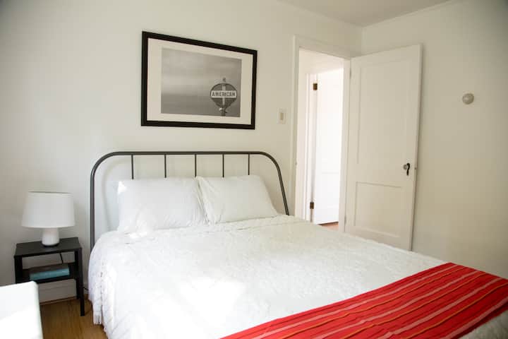 Guest Room #1 features a large closet and a queen sized bed.