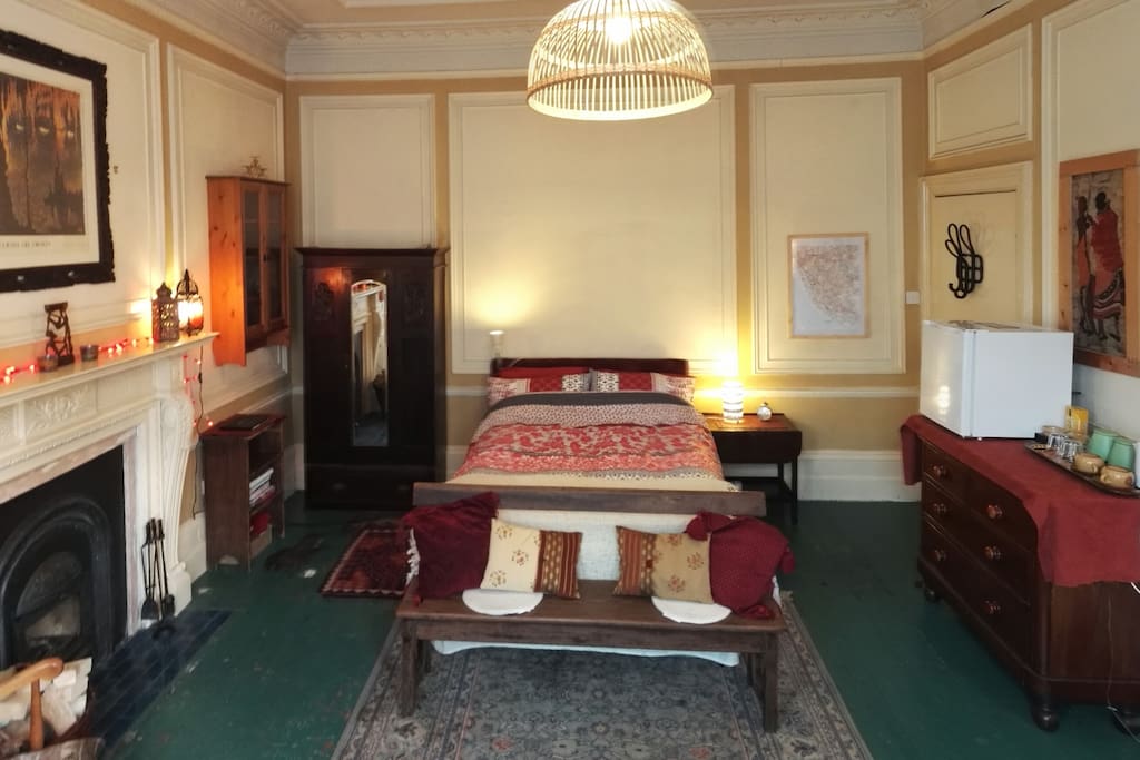A cosy double bed in our spacious room with lots of original period features.