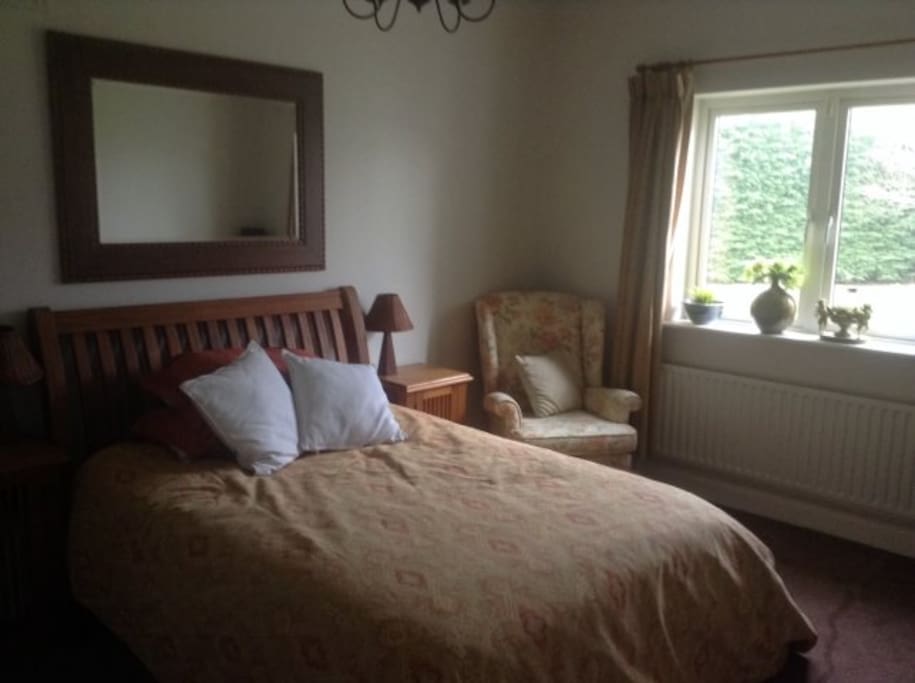 Large double bedroom looking onto the garden.