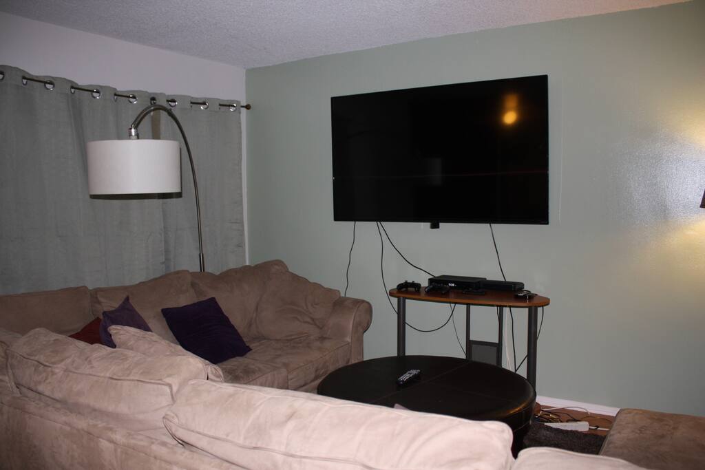 Living room with 70" TV! Xbox One, Cable/DVR all in beautiful HD. Huge L Couch that can fit up to 7