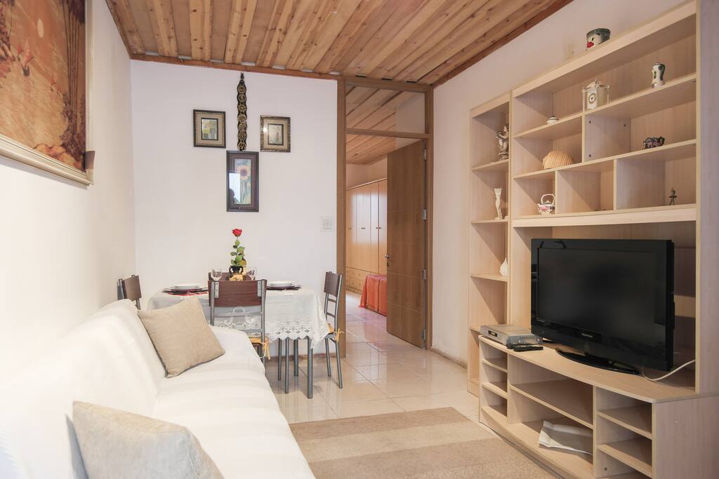Fold out couch, TV and Maltese style romantic art