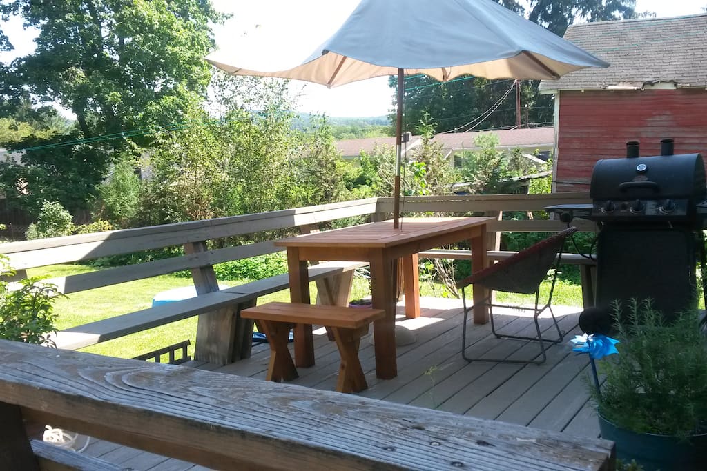 Outside deck with gas grill, picnic table and wonderful view of the hills