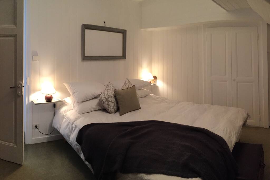 Open the shutters from the upstairs master bedroom to see mountains and lake glimpses