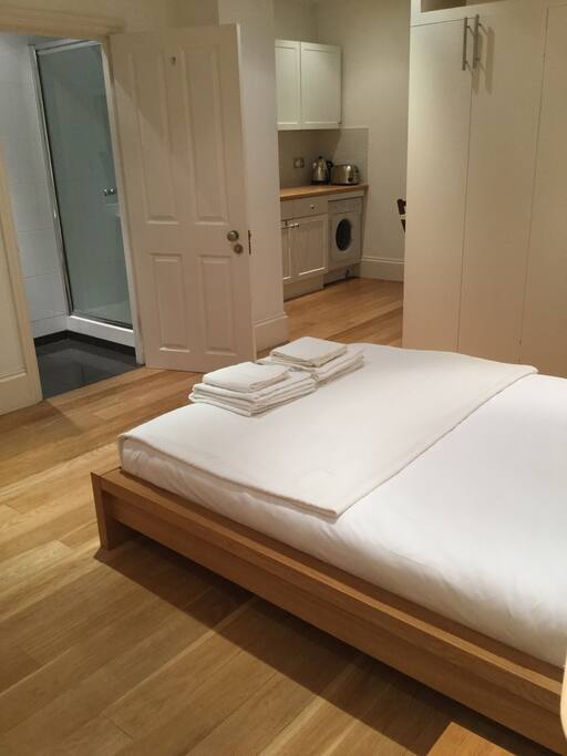 Queen size new mattress with comfortable feather down pillows and duvet