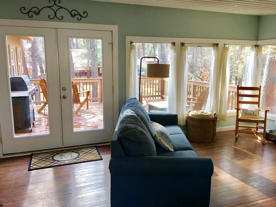French doors lead to large deck overlooking the Rio Ruidoso