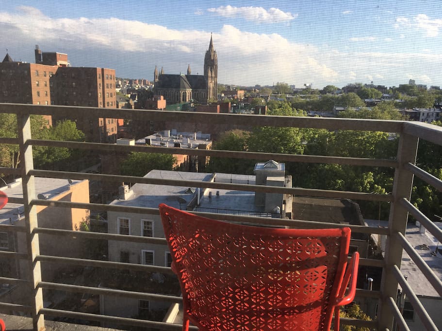 Apartment features balcony with views of brownstone Brooklyn.