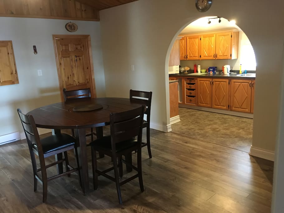 Spacious dining room beneath beautiful cathedral pine ceiling