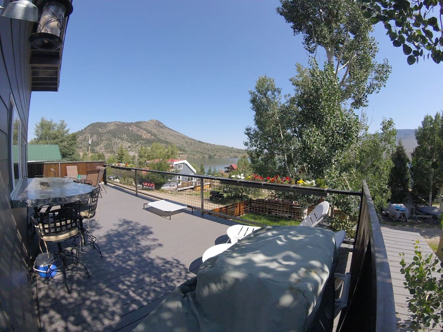 Deck view. Grill, lounge chairs, bar