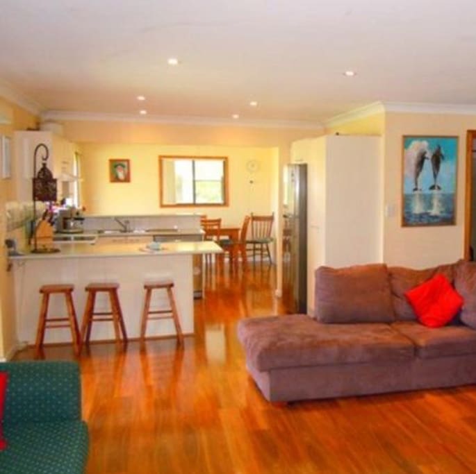Open plan living lounge room entertainers kitchen and dining room