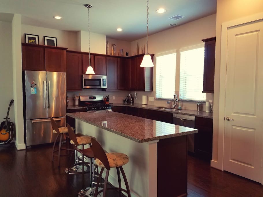 Fully furnished kitchen, with security camera located on top of cabinets.