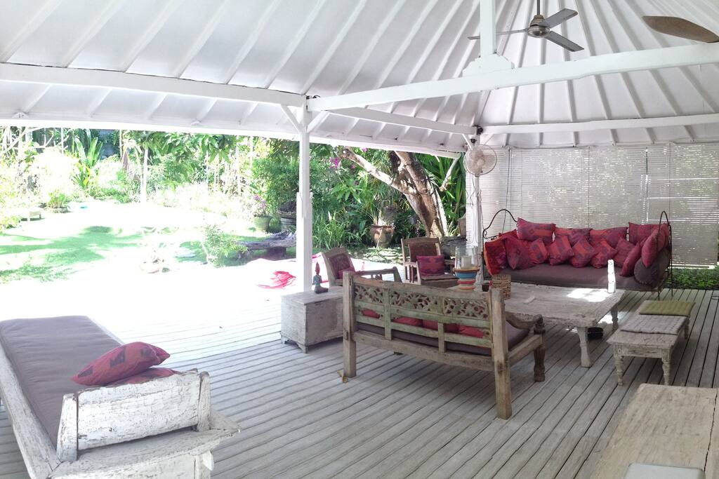 Lounge Area with a garden and swimming pool view
