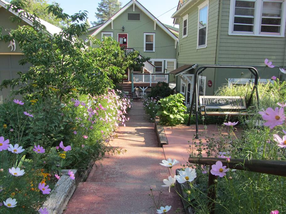 enter from the back gate Carriage House on the right