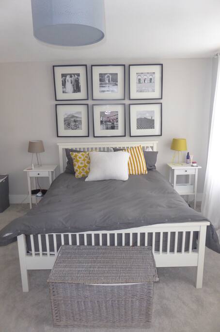 Master bedroom with kingsize bed and Victorian fireplace