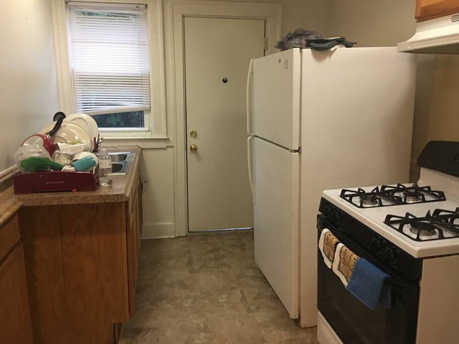 KITCHEN which includes, stove, refrigerator, coffee maker, toaster and microwave.