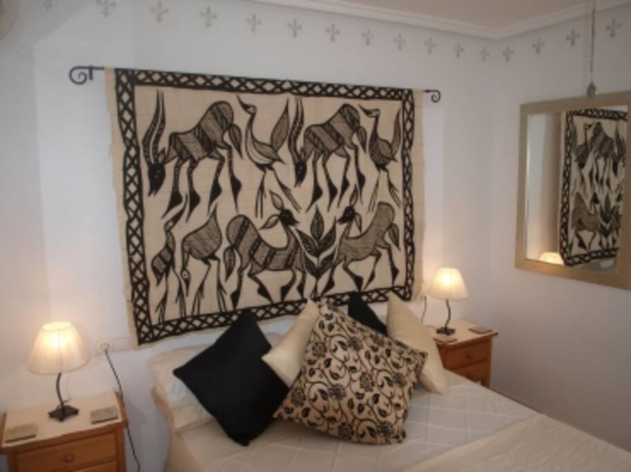 Mater bedroom with kingsize bed and fitted wardrobe