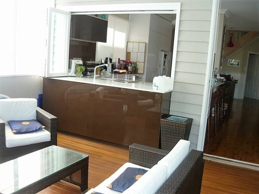 Outside on deck looking into kitchen