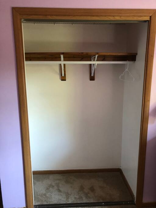 Closet with doors removed for full view.