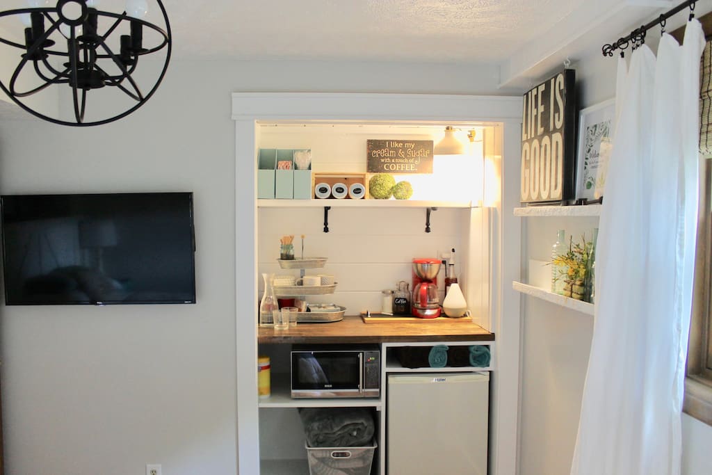 Bedroom - TV and in-room coffee/tea bar. Includes a microwave, mini-fridge and various drinks and small snacks.