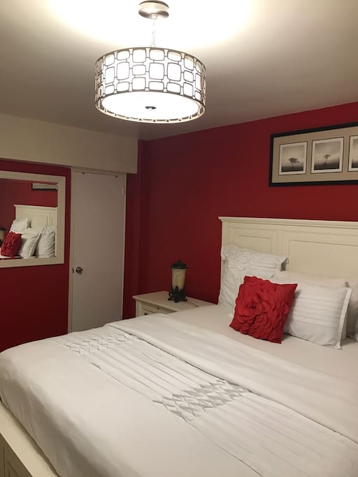 beautiful Chandelier above the bed.
