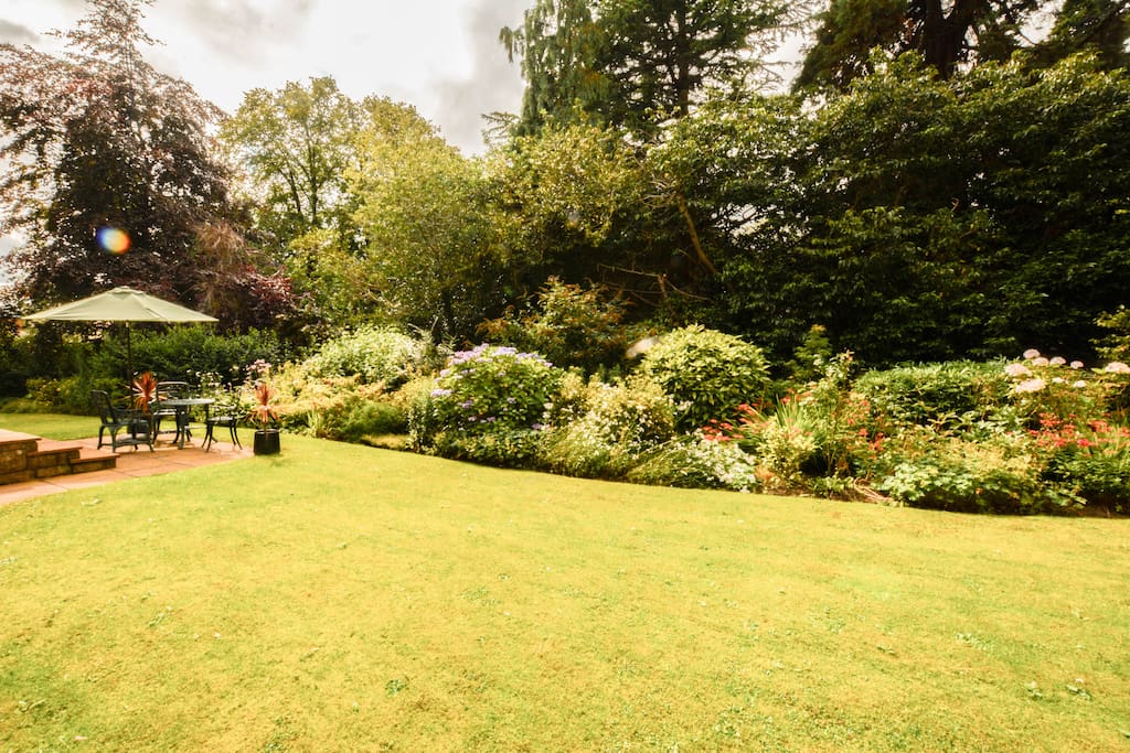 Lawns and gardens
by Lounge French windows