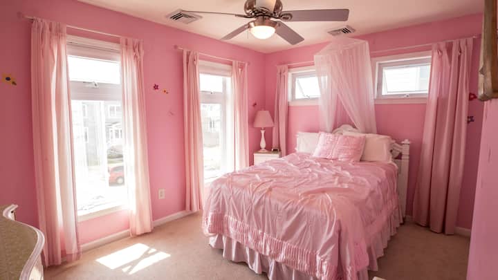 We're sure to brighten up your mood with this extremely vibrant Pink Bedroom!