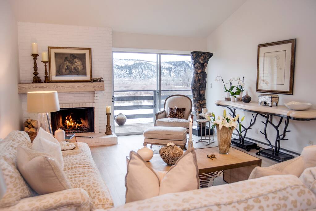 Living room with fireplace and lake views