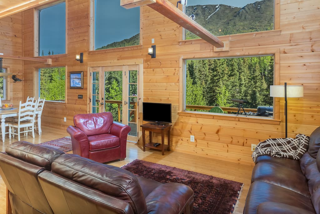 The main living area has two leather couches with reclining ends (4 recliners in all), a leather armchair, and an Internet-connected TV set with Netflix logged in for you