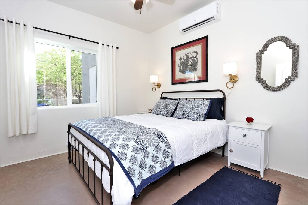 Luxurious bedding and elegant lighting will make you want to read in bed in the morning.