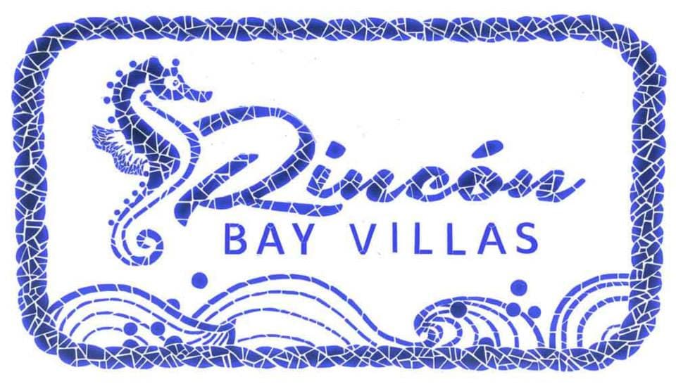 The logo of Rincon Bay Villas features an elegant design with a seahorse and waves. The text 'Rincón Bay Villas' is prominently displayed, surrounded by a decorative border, conveying a coastal theme.