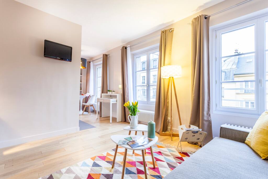 Spacious living room with TV