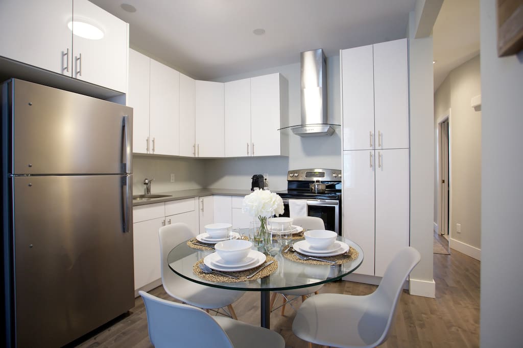 Full kitchen with real dishes with real cutlery.