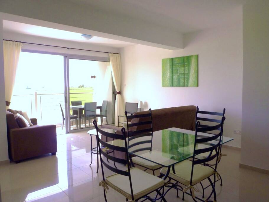 Lounge and dining area leading onto balcony and sea-views