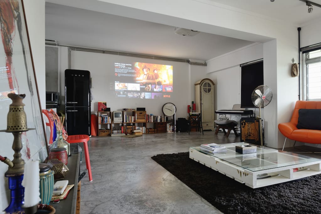 Living room with projector so you can watch movies like in a theatre!