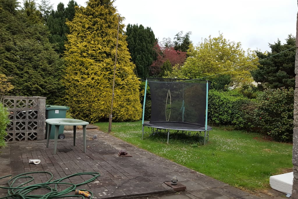 Back garden with raised patio area. Feel free to use the trampoline! (Or trampoline can be removed upon request)