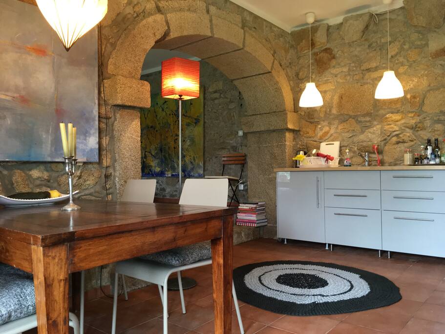 Fully equipped kitchen with lots of plates, bowls, cutlery, pans, etc.