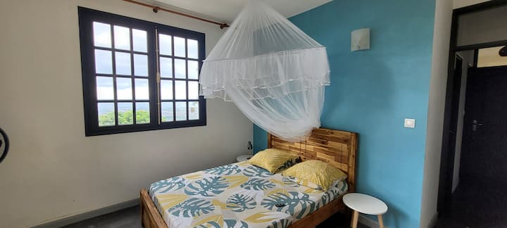 Another bedroom on the ground floor with a magnificent view of St Paul's Bay 