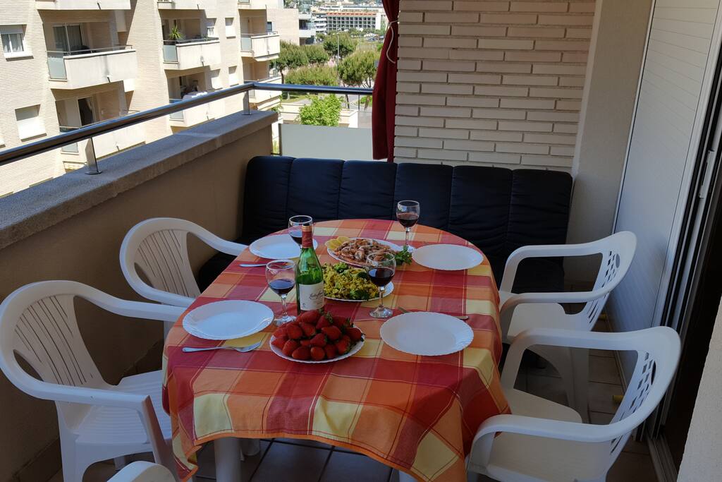 Sizable terrace with awning and swimming pool view