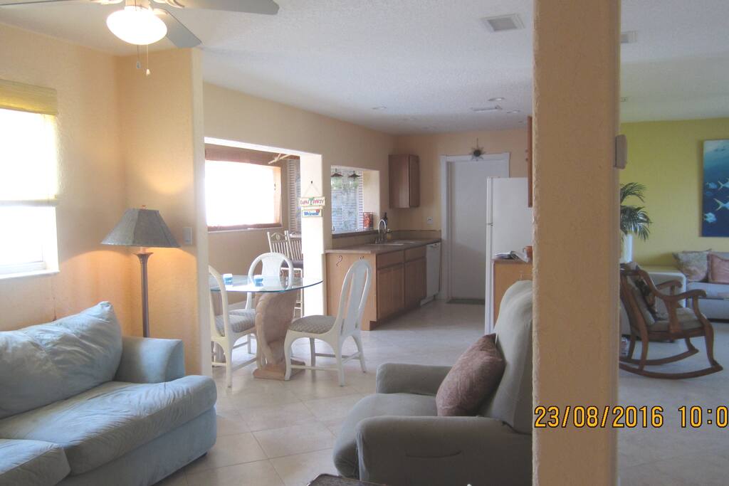 comfy seating in family room off the bright cheerful dining area