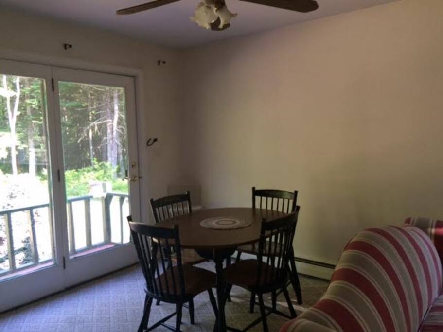 Small dining space with a door that goes to the small back deck