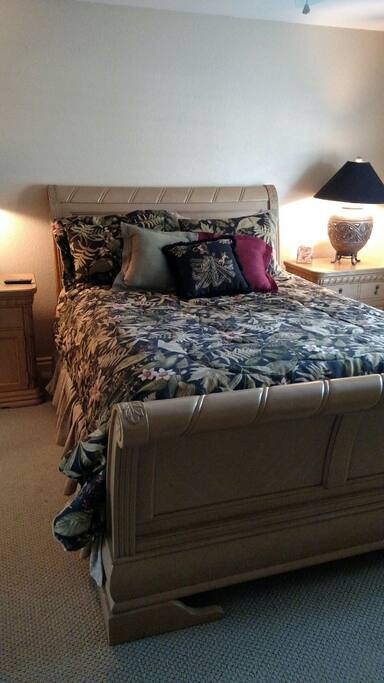 Queen size bed for two, tv and shared bathroom.