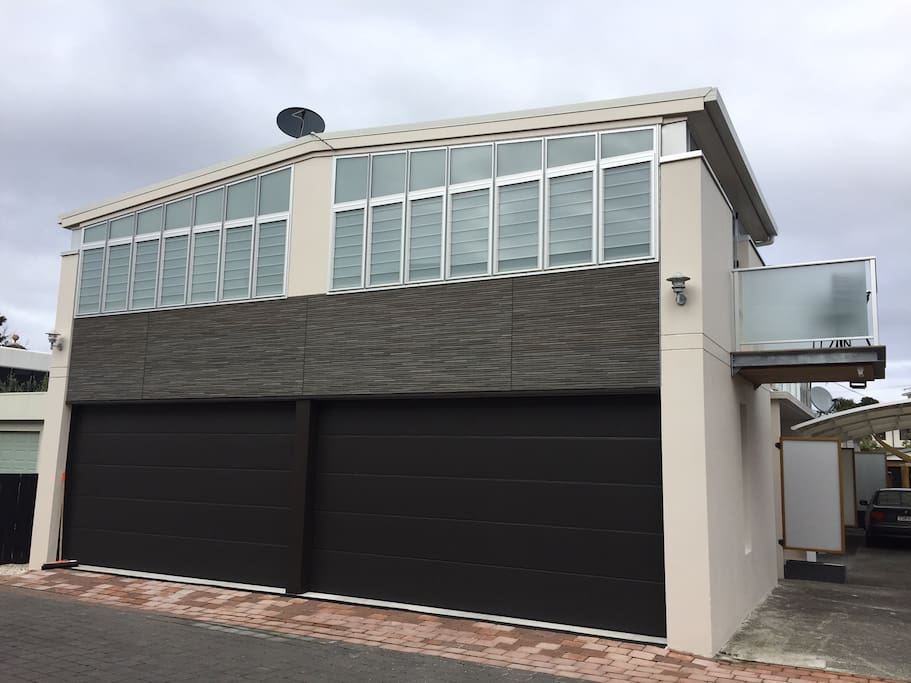 Front of Apartment above , garage to left side