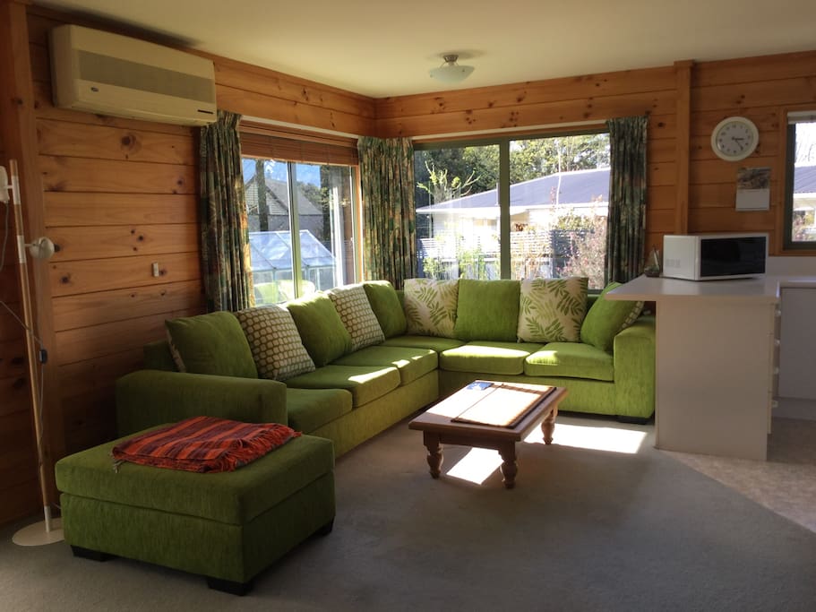 Sunny sofa corner next to kitchen