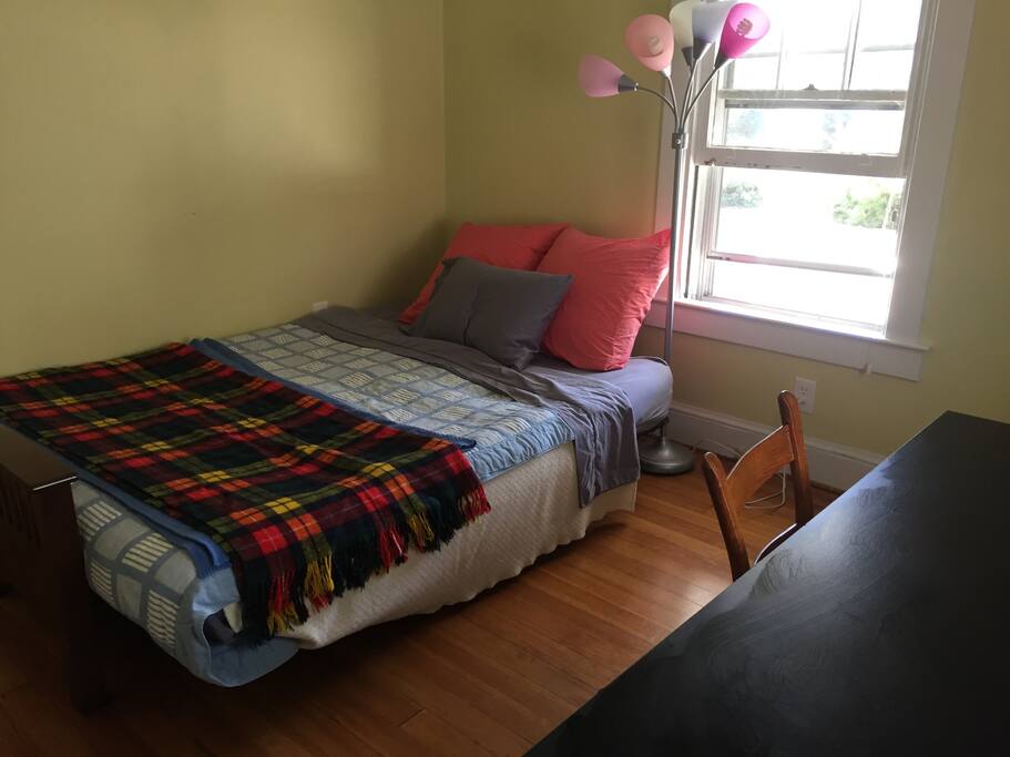 Guest room: queen size futon, desk, closet.