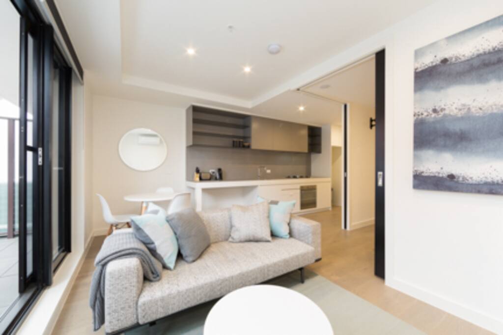Open plan living, dining, kitchen with timber floors throughought