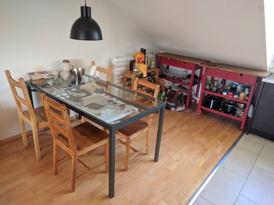 The dining table is in the west-facing side of the living area
