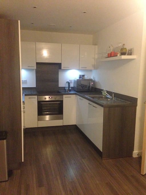 Kitchen with electric hobs, fan assisted oven, microwave, large fridge, large freezer, kettle, kitchen utensils, tea, coffee etc